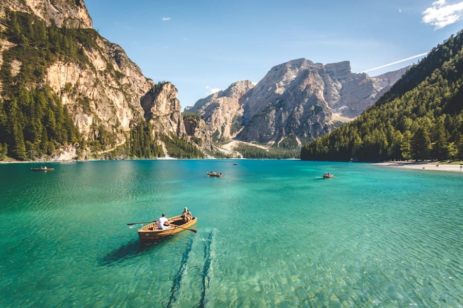 Mountain lake surrounded by forest and peaks